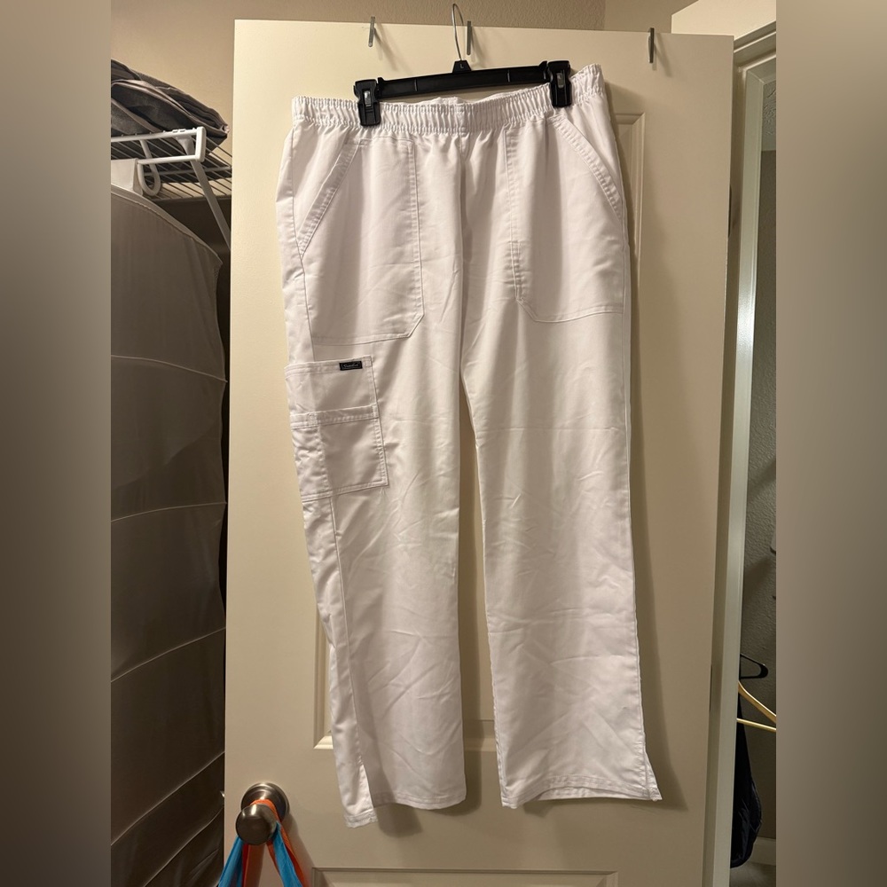 White Nurse pinning Pants